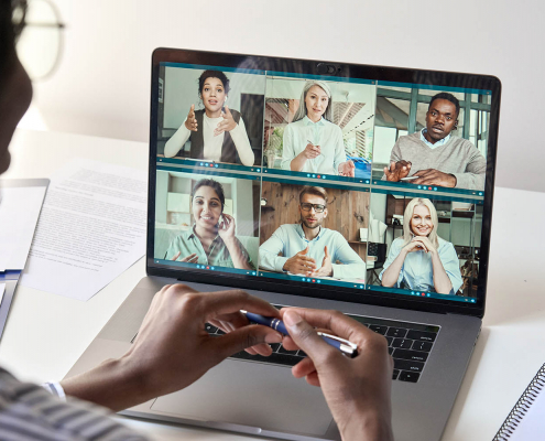 Black woman manager having virtual meeting with diverse business people.